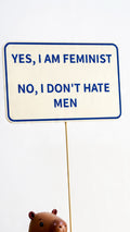 sign “feminist”